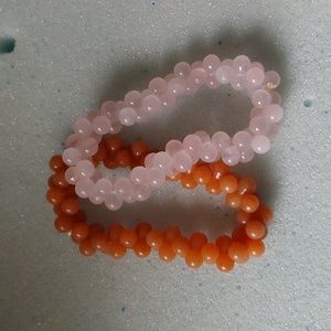 Two 'girls' stretch bracelets. 1 Rose quartz, 1 carnelian... 3.5 " each.